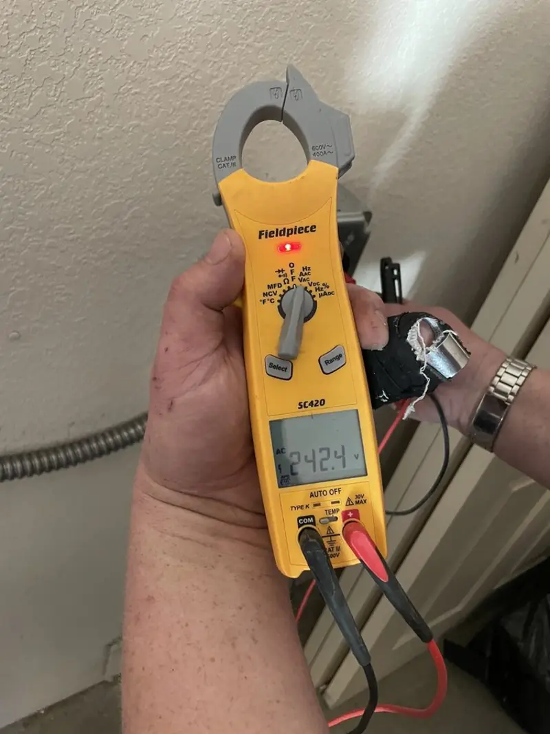 Voltage testing with clamp meter during Whole House Surge Protector in Richland